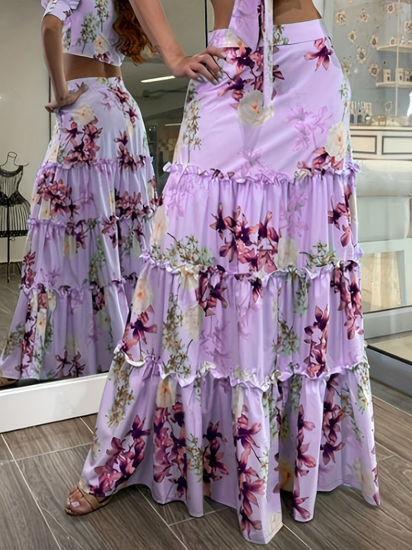 Dameskjørt med blomstertrykk og A-linjeformet stoff og rysjer i kanten - lys lilla, elegant feriestil, perfekt for utendørsarrangementer, design med høy midje, livlig blomstermønster, skjørt med høy midje